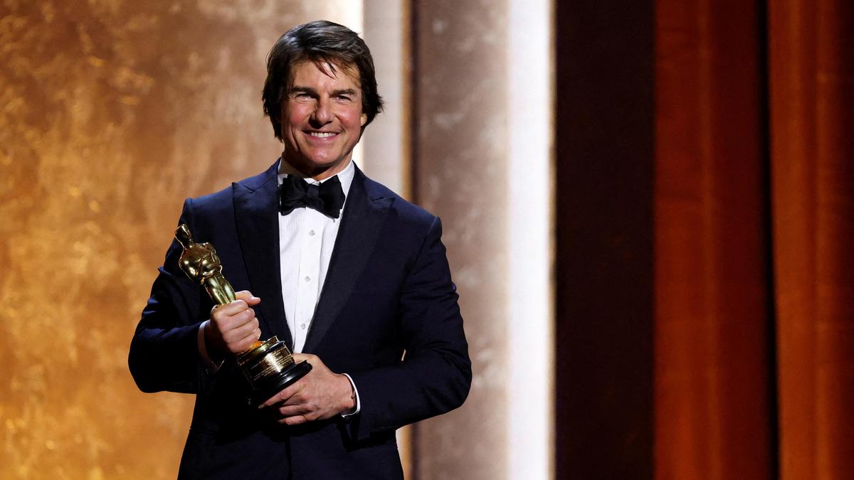 Tom Cruise touts the power of cinema as he accepts honorary Oscar